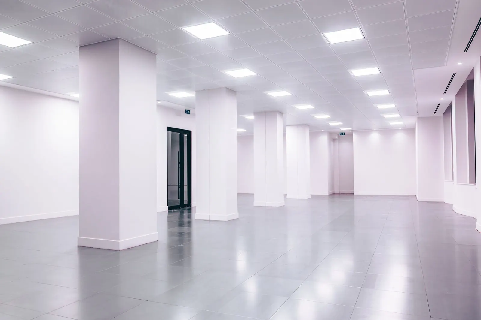 A bright commercial lobby with polished floors and glass walls