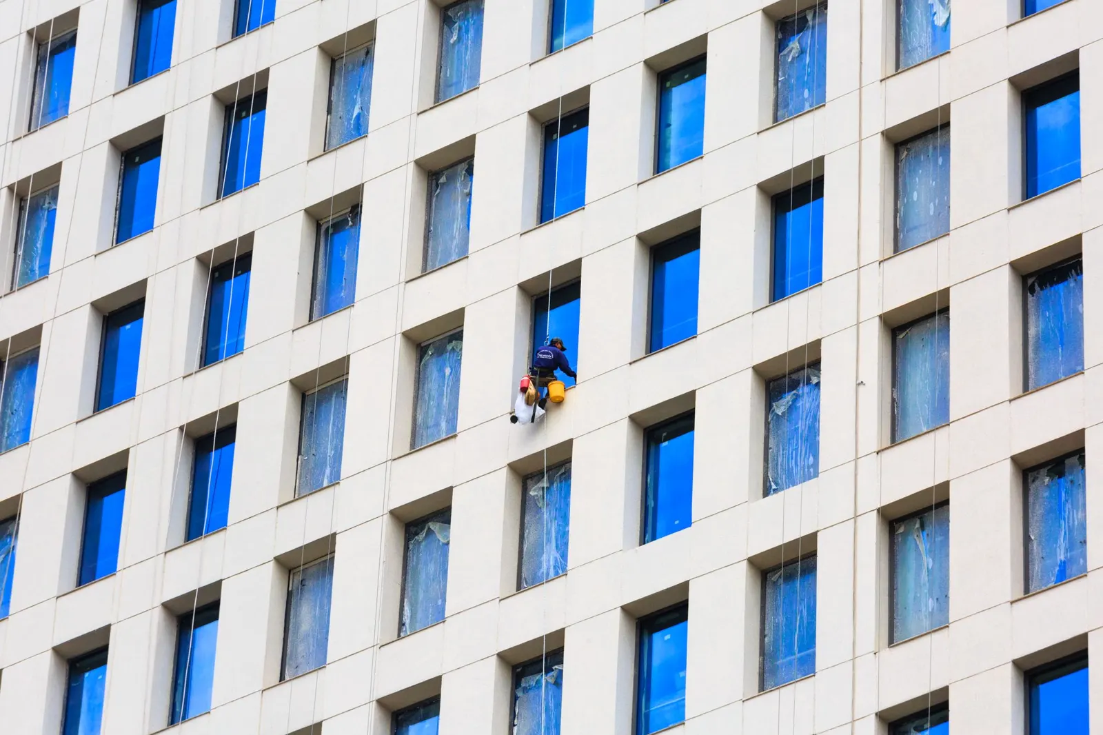 Clean floor-to-ceiling windows in a commercial building